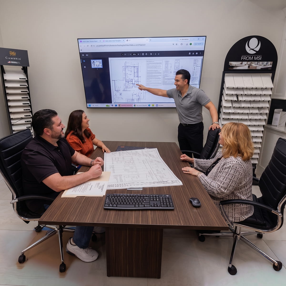 Design build contractors helping homeowners plan a home renovation in the DG showroom in New Jersey
