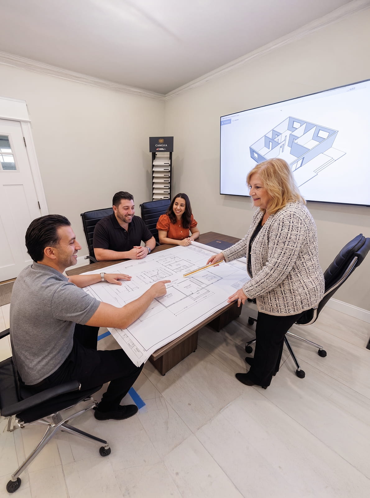 Home addition builders reviewing custom home expansion plans with homeowners in New Jersey